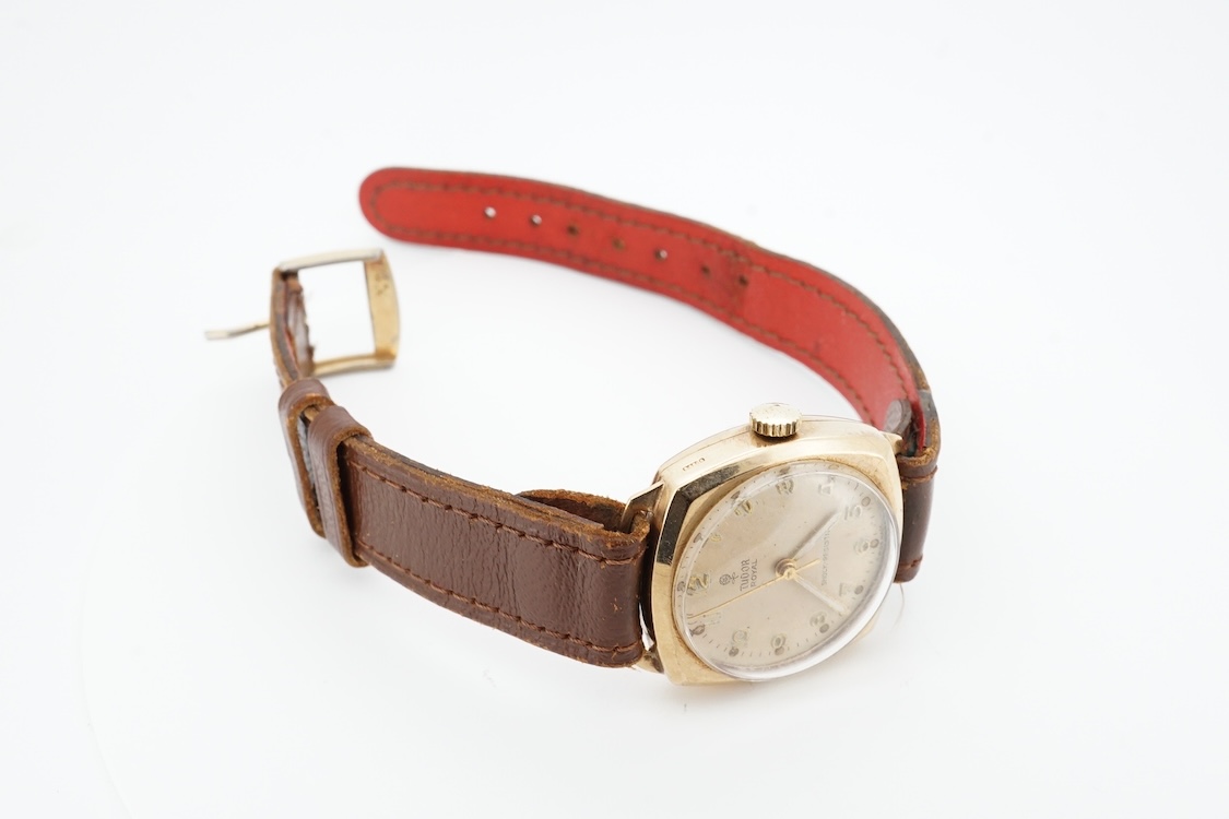 A 1950's 9ct gold Tudor Royal manual wind wrist watch, with Arabic dial, case diameter 27mm, with case back inscription, on a later associated strap.